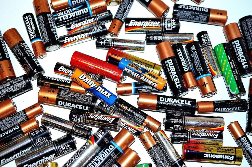 How do batteries produce electricity